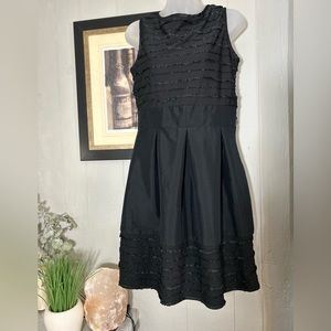 Little Black Dress. Sleeveless, stretch material. Low back.
